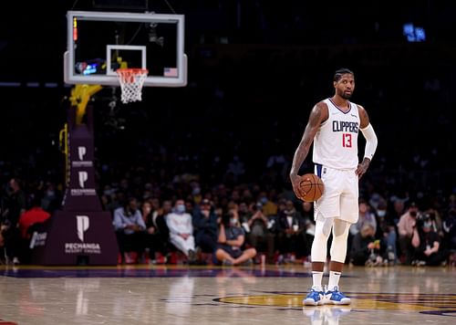 Paul George #13 of the LA Clippers holds the ball for the final shot of the third quarter during a 119-115 Clippers win over the Los Angeles Lakers at Staples Center on December 03, 2021 in Los Angeles, California.