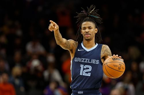 Memphis Grizzlies guard Ja Morant handles the ball in the first half against the Phoenix Suns.