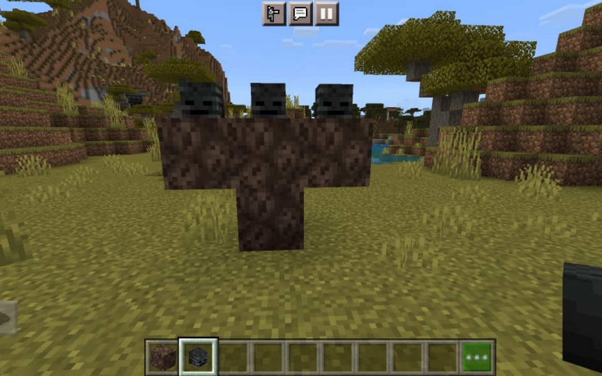 Arrangement of the soul sand and Wither skull to summon Wither (Image via Minecraft)