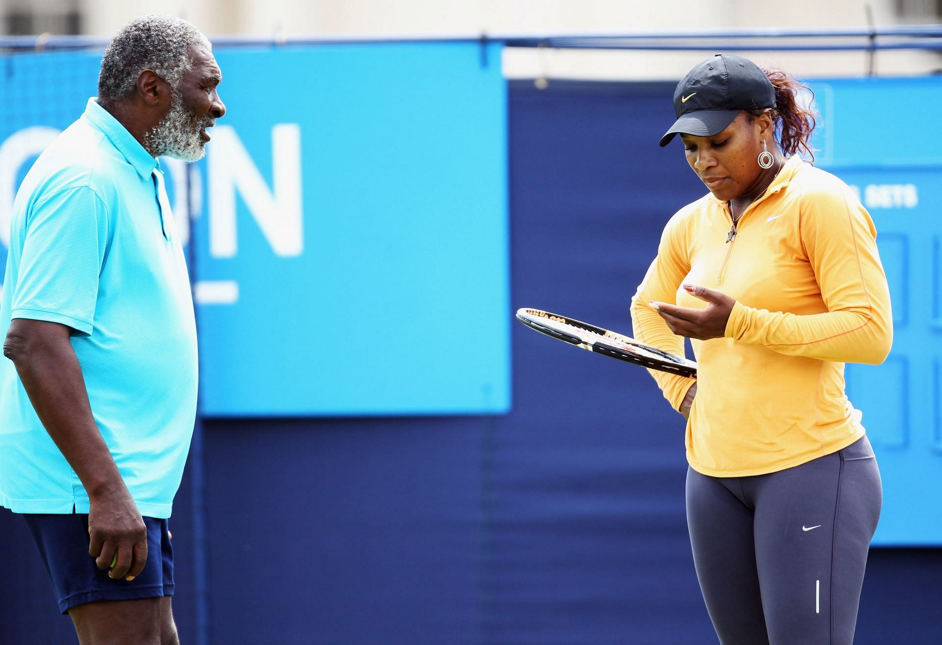 Serena chatting with her father Richard during a break circa 2011