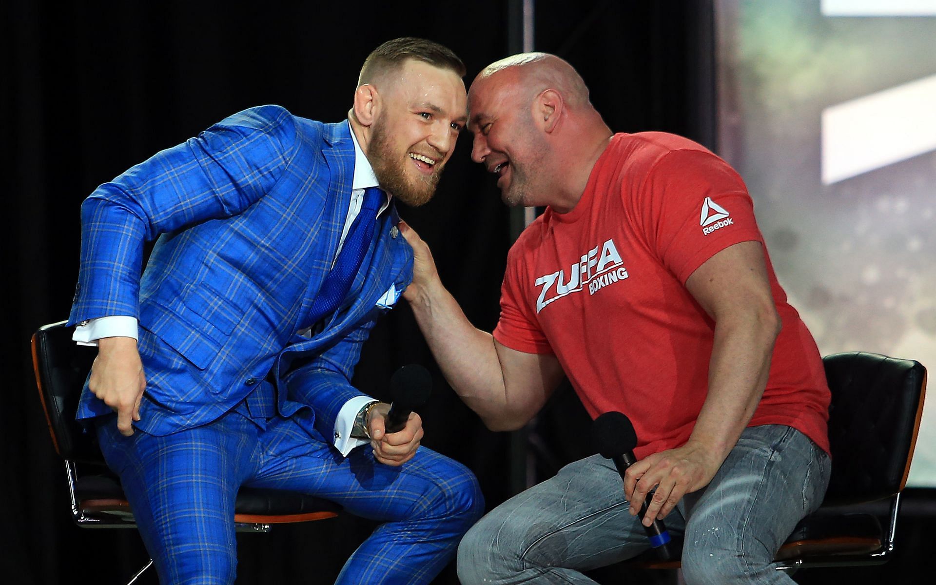 Conor McGregor (left) speaks with Dana White (right) during the Floyd Mayweather Jr. vs. McGregor World Press Tour