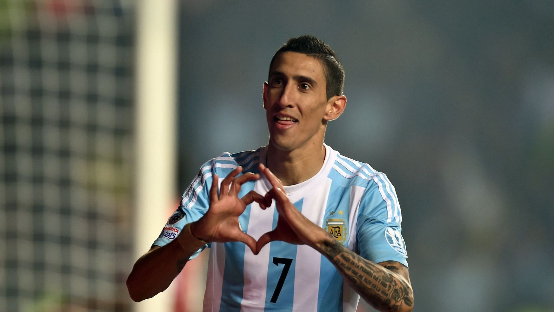 Angel Di Maria doing his trademark celebration after scoring for Argentina.