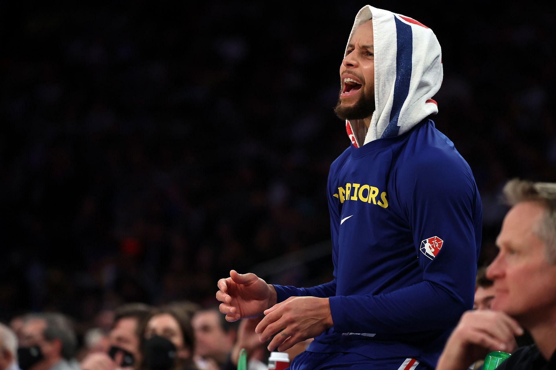 Stephen Curry cheers as Golden State played the New York Knicks on Dec. 14 in New York City.