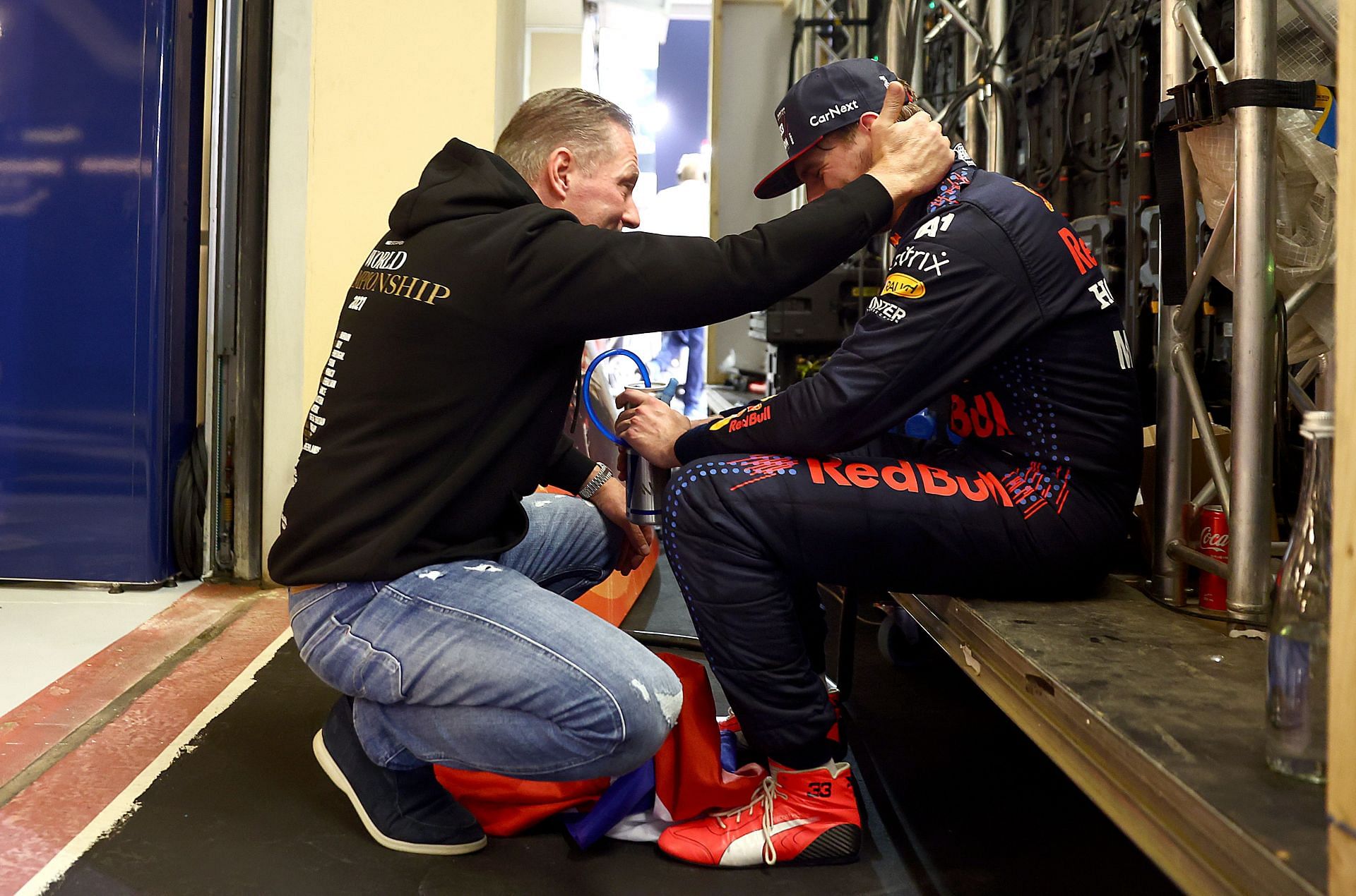 Max Verstappen (R) with his father Jos Verstappen at the Parc Ferme after becoming the 2021 F1 world champion. (Photo by Mark Thompson/Getty Images)