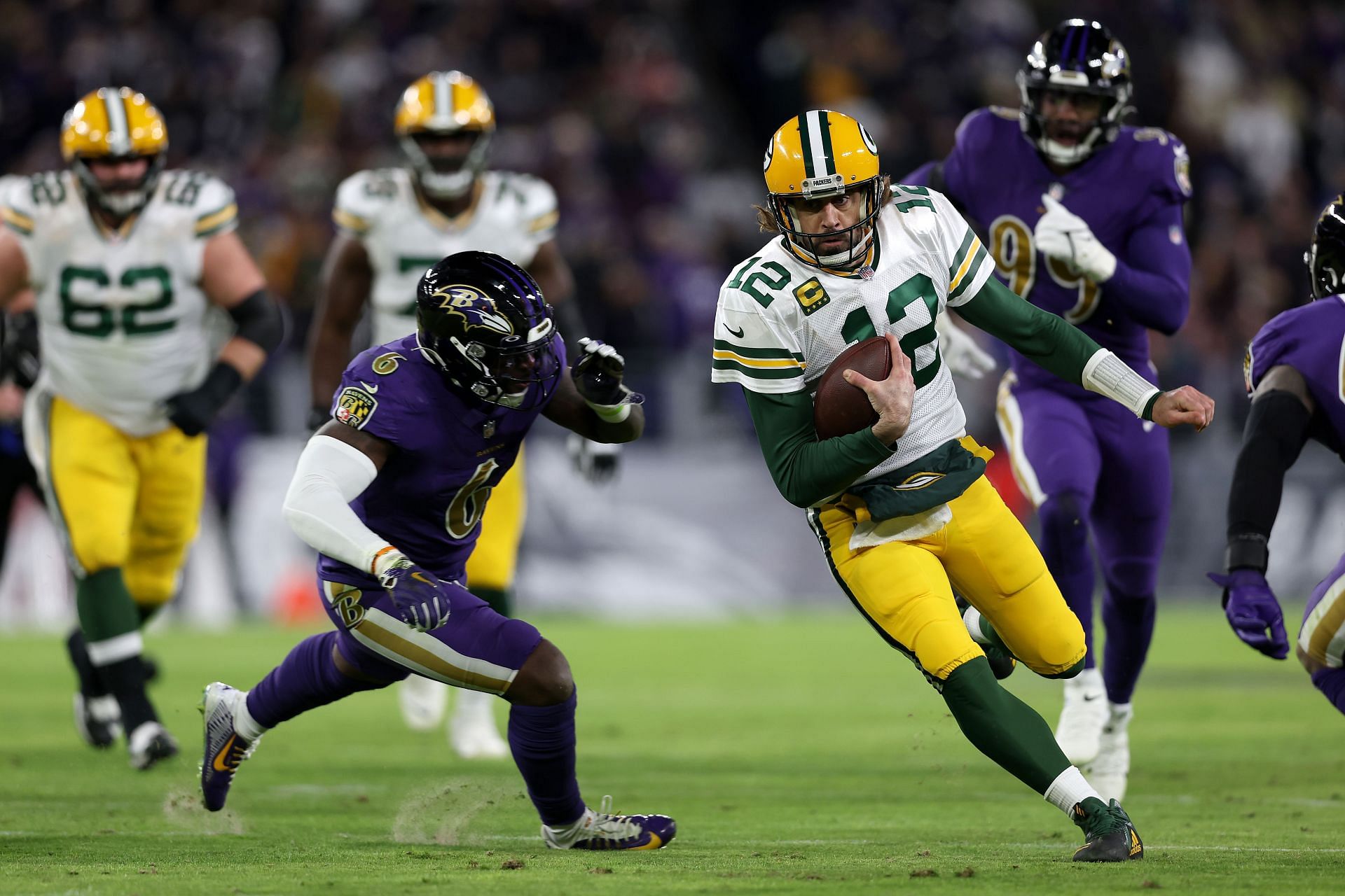 Aaron Rodgers is on the run vs. Baltimore Ravens in Week 15