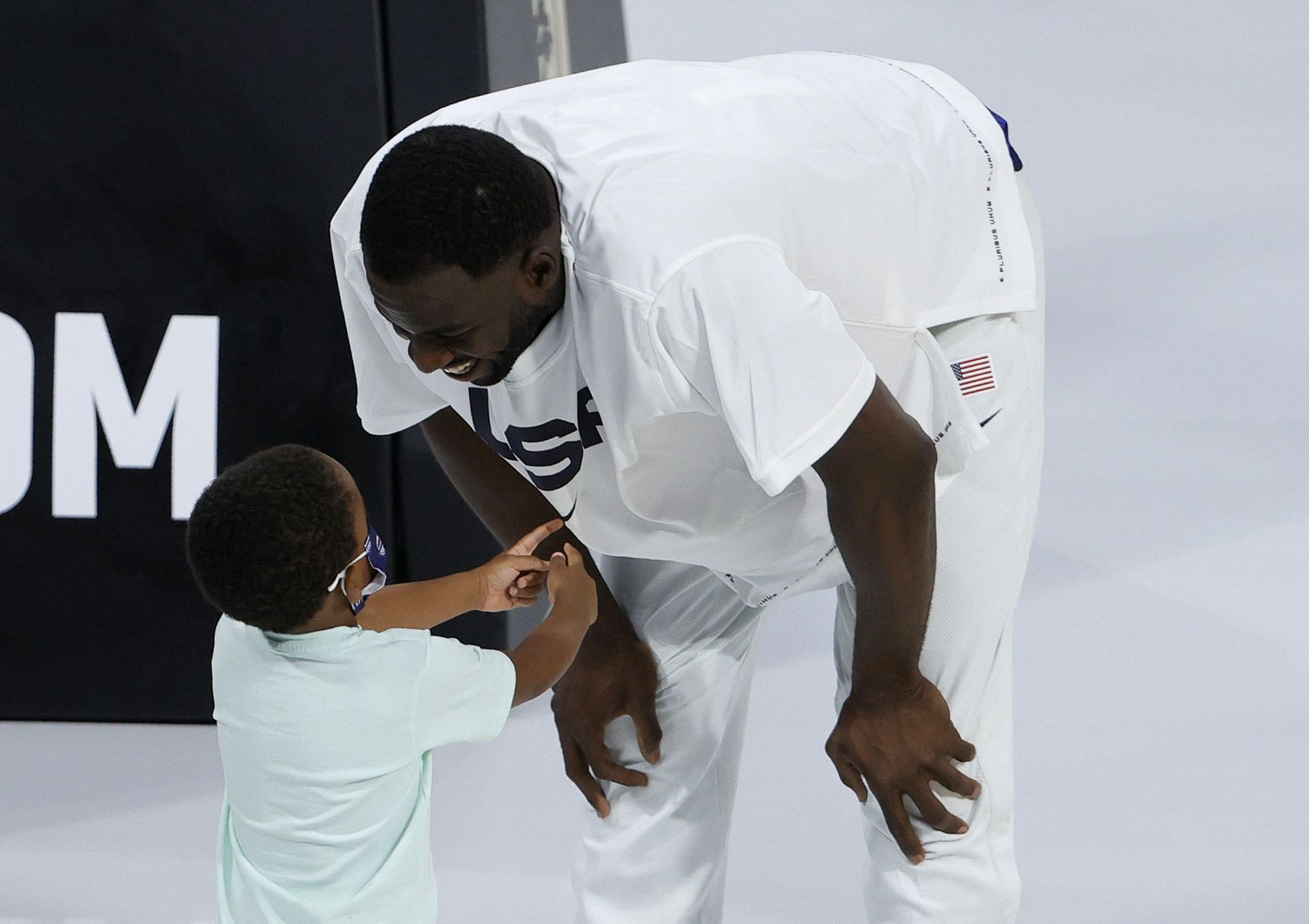 Draymond Green with his son in a game for the United States