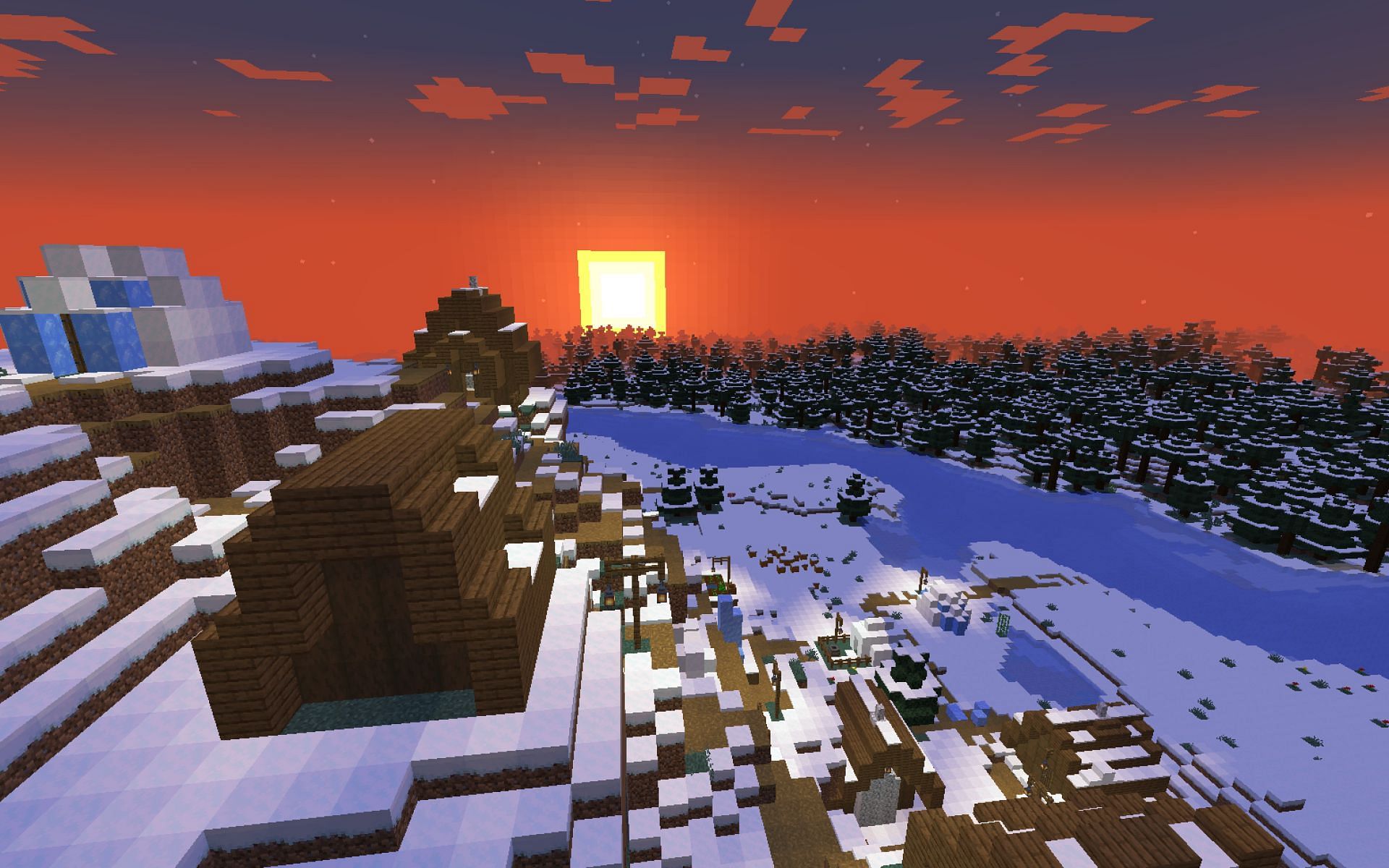 A screenshot of a snowy plains village at sunset. (Image via Minecraft)