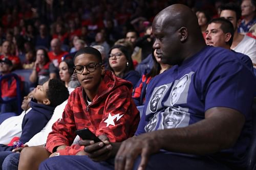 Shaquille O'Neal with his son Shareef (left) for a college game