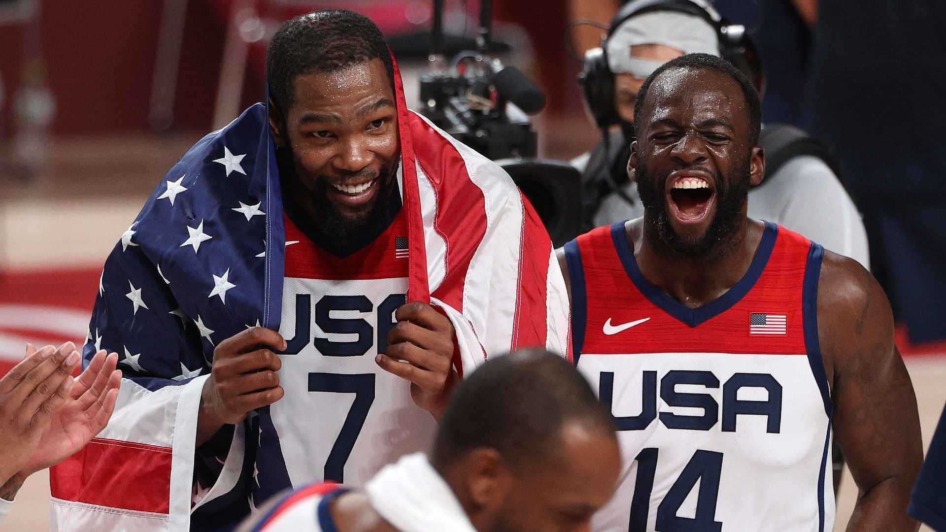 Draymond Green, right, is in disbelief watching how good Kevin Durant, left, has been this season. [Photo: Sporting News]