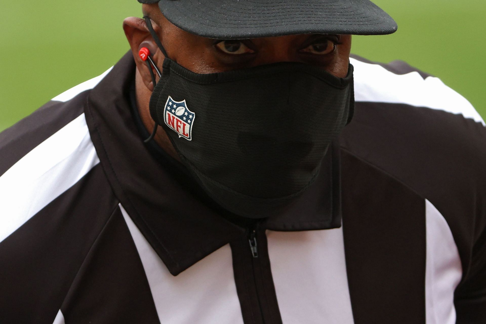 An NFL official wearing a mask