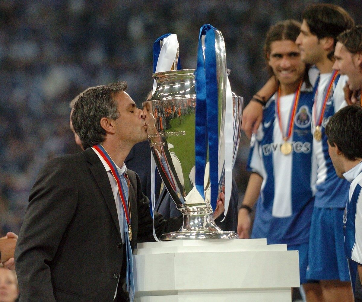 Former FC Porto manager Jose Mourinho kisses the Champions League trophy after his team&#039;s triumph in 2004.