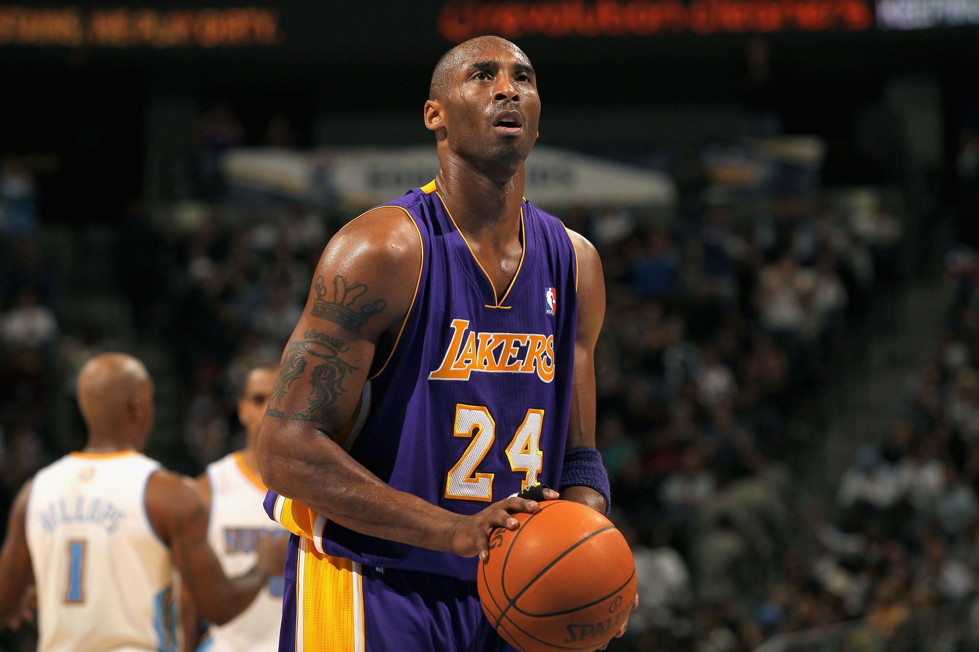 Kobe Bryant #24 of the Los Angeles Lakers takes a free throw against the Denver Nuggets