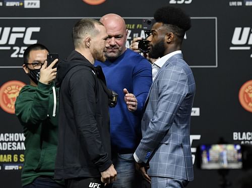 Bantamweight rivals Petr Yan (left) and Aljamain Sterling (right) with the promotion's president Dana White (center) at the UFC 259 press conference and face off