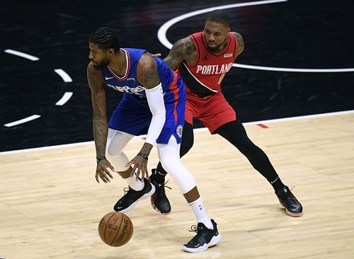 Damian Lillard of the Portland Trail Blazers against LA Clippers' Paul George