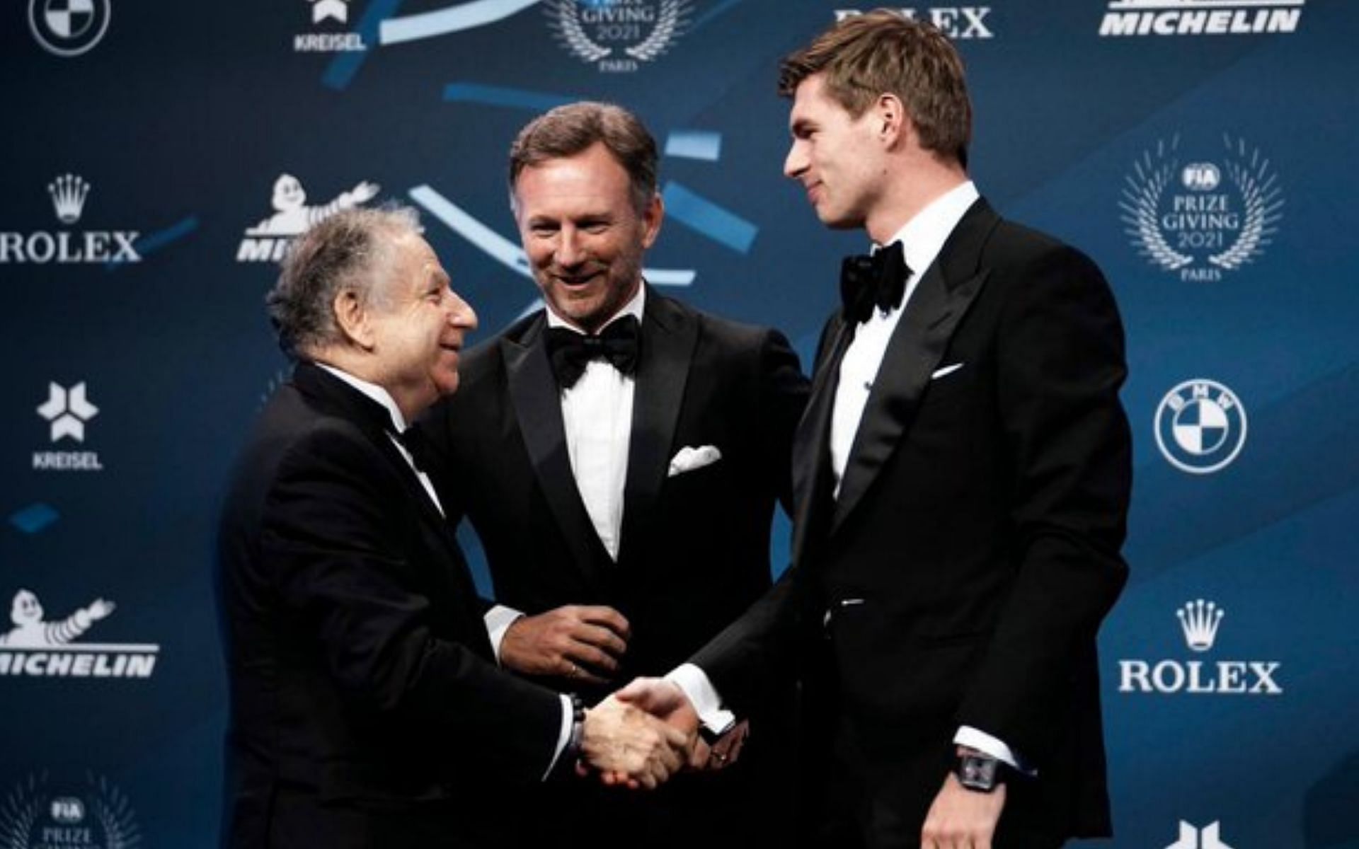 Jean Todt (congratulates) Max Verstappen (right) on his maiden F1 World Championship, as Red Bull team principal Christian Horner (middle) watches on. Courtesy: Jean Todt/@Gazzetta_it