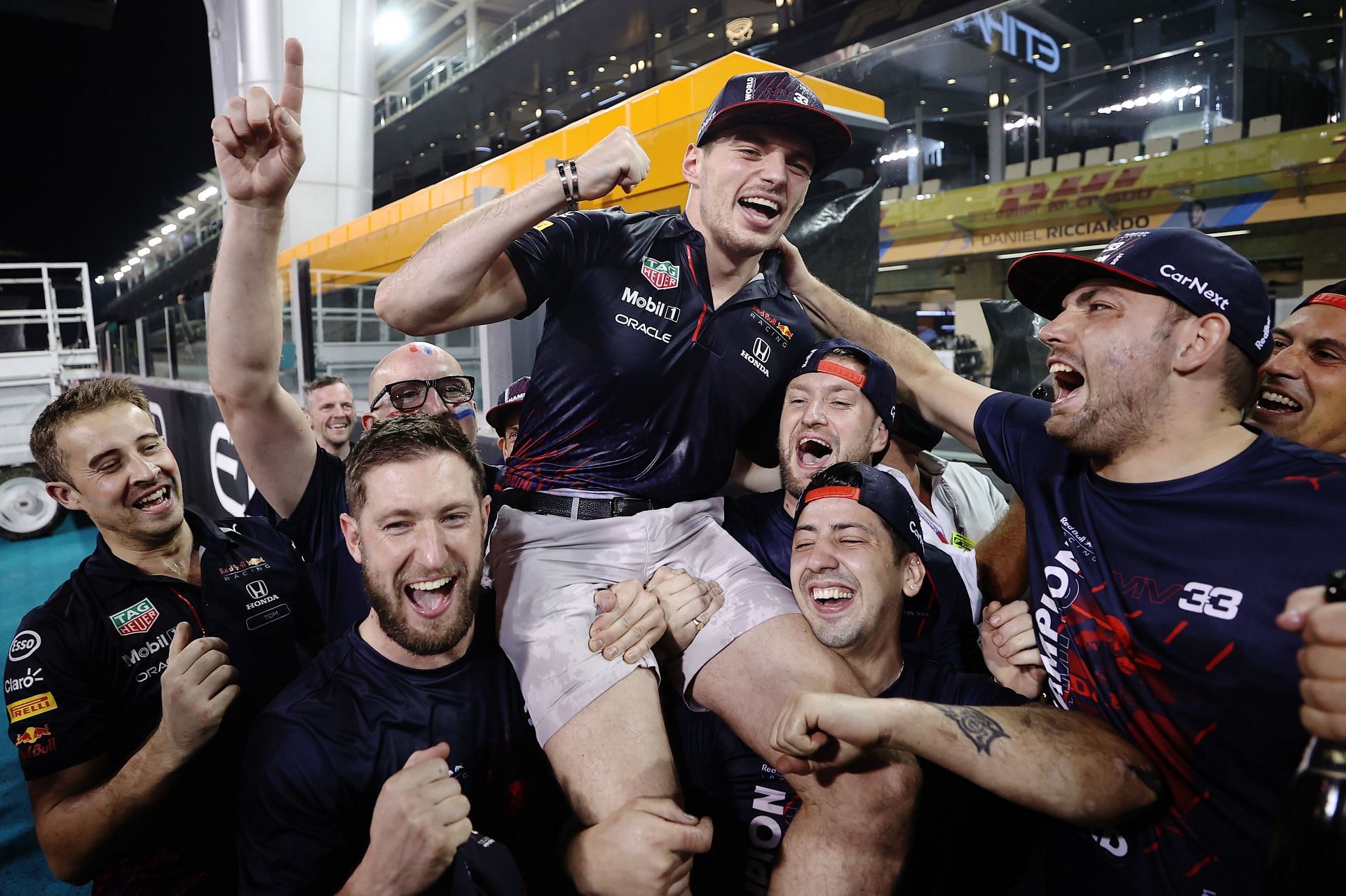 Race winner and 2021 F1 World Drivers Champion Max Verstappen celebrates with his team after the F1 Abu Dhabi GP. (Photo by Lars Baron/Getty Images)