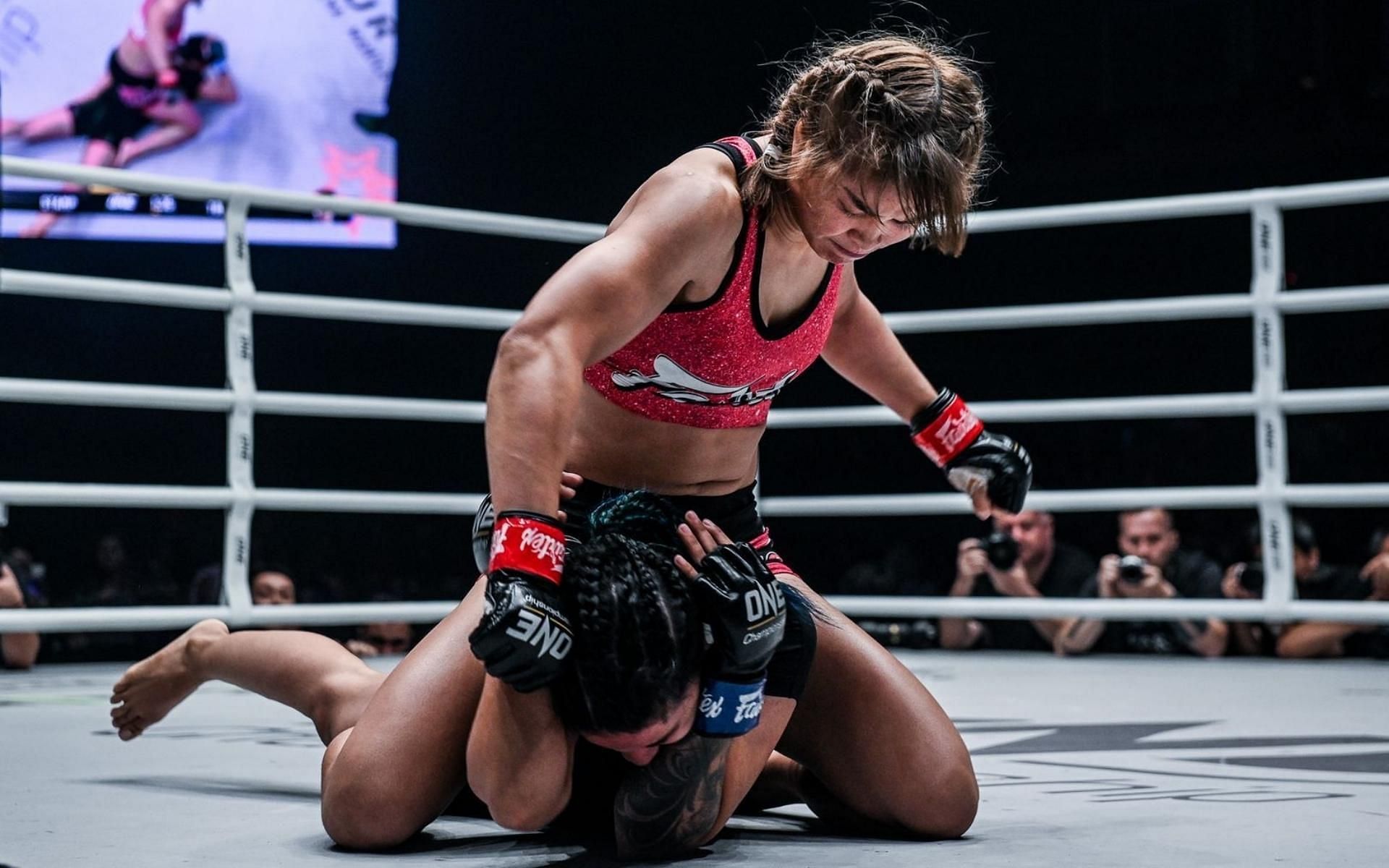 ONE Championship atomweight world Grand Prix champion Stamp Fairtex (top) might see gold around her waist in 2022. (Image courtesy of ONE Championship)