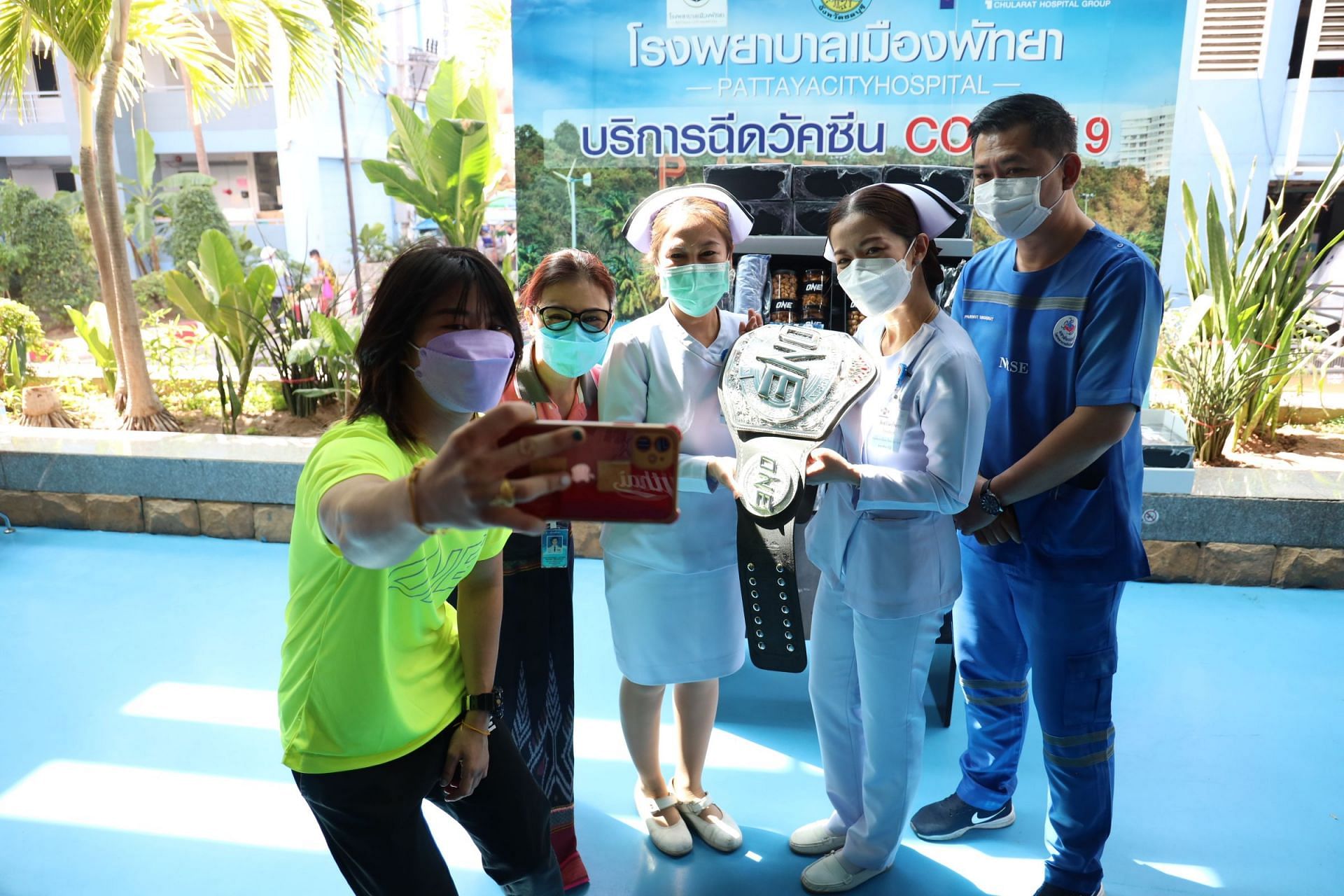 Stamp Fairtex poses for pictures with some nurses | [Photo: Fairtex Gym]