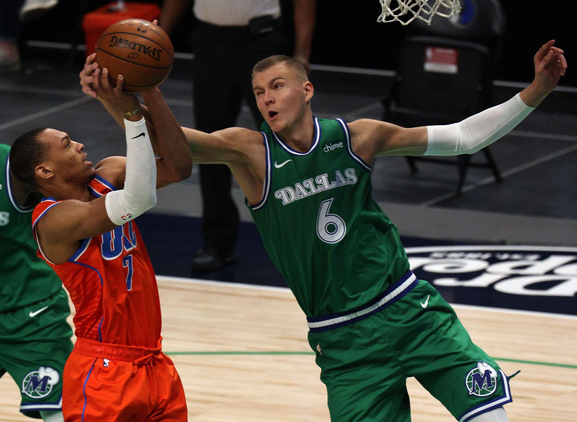 Darius Bazley of the OKC Thunder gets his shot blocked by Dallas Mavericks&#039; Kristaps Porzingis.