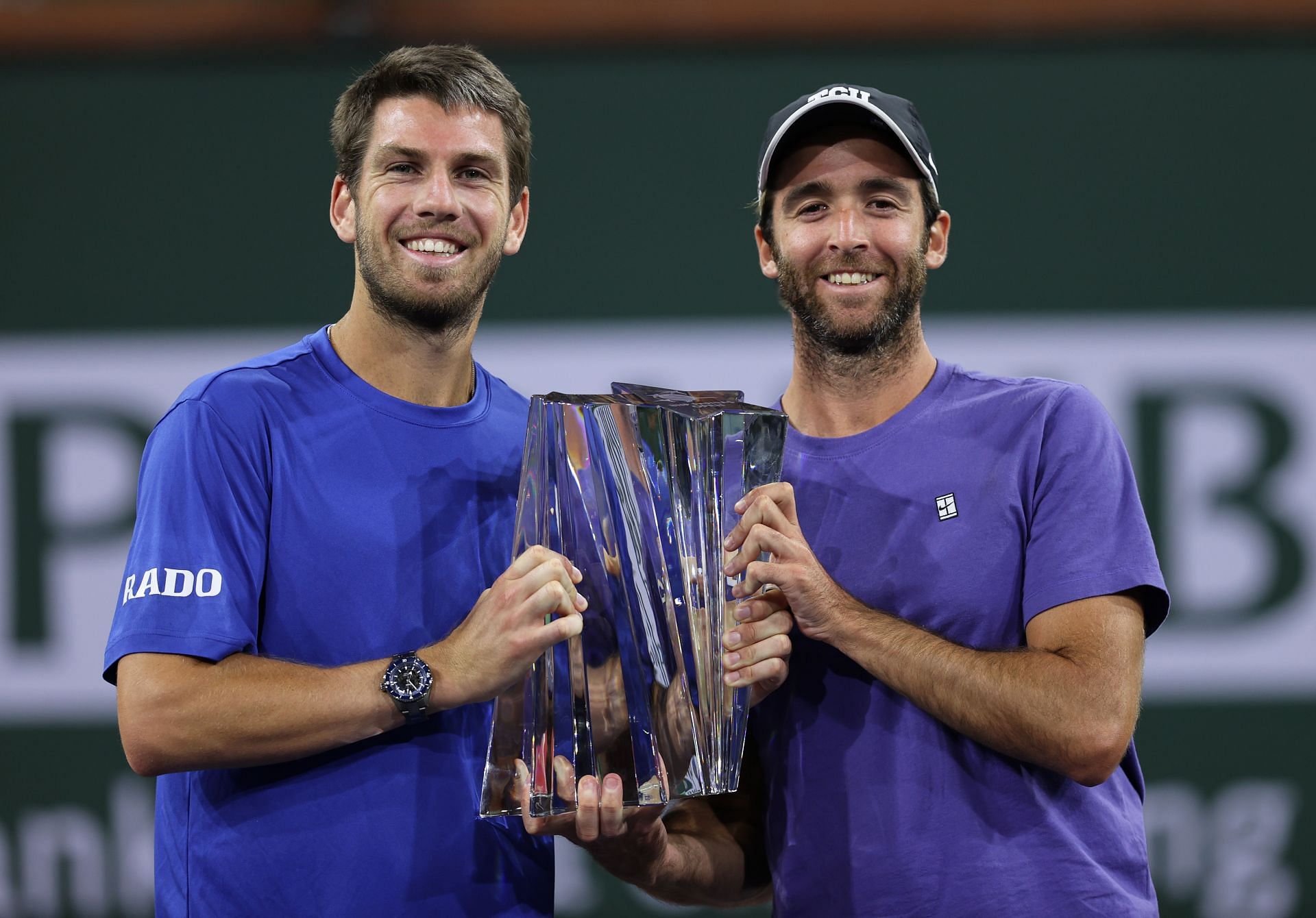 Cameron Norrie (L) celebrates with coach Facundo Lugones (R) after winning the 2021 Indian Wells Masters