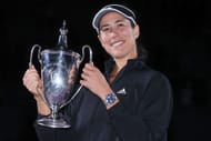 Garbine Muguruza celebrates with the 2021 WTA Finals trophy