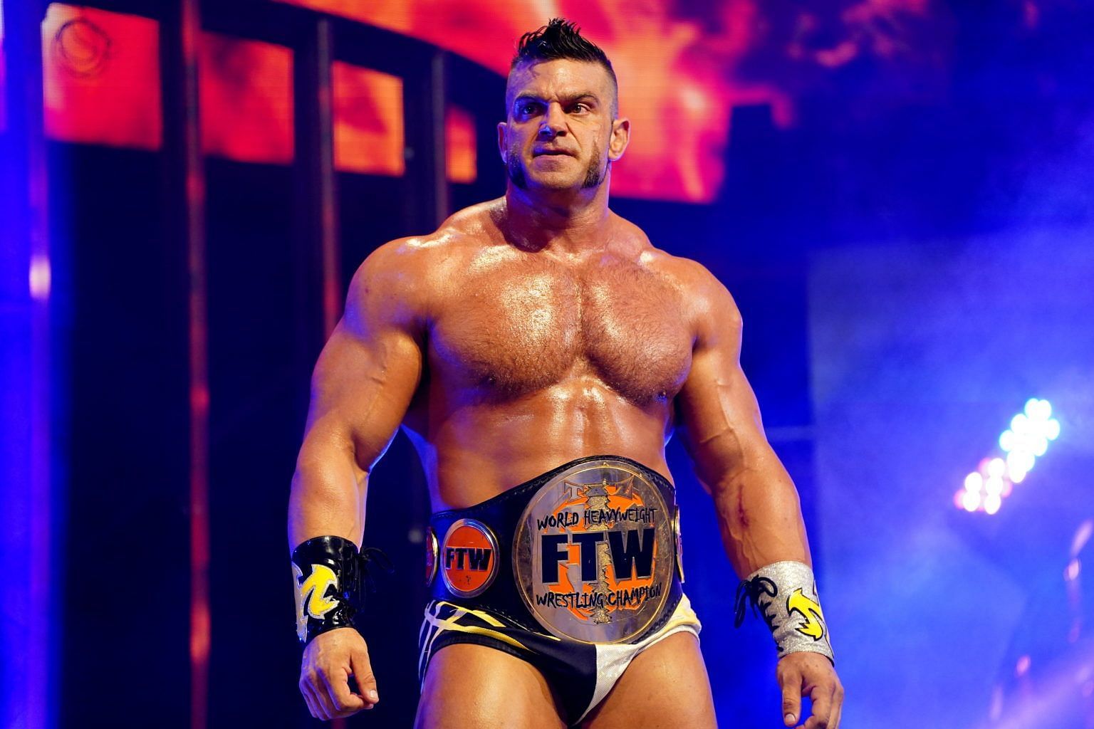 Brian Cage performing for AEW as FTW champion