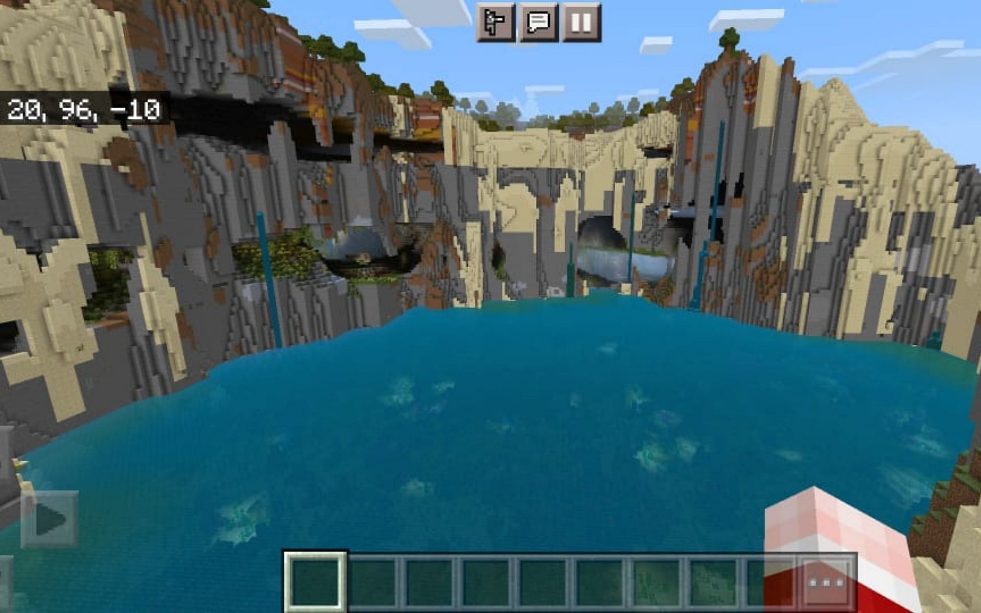 A mountain surrounding coral reefs and also has lush cave biomes within them (Image via Minecraft)