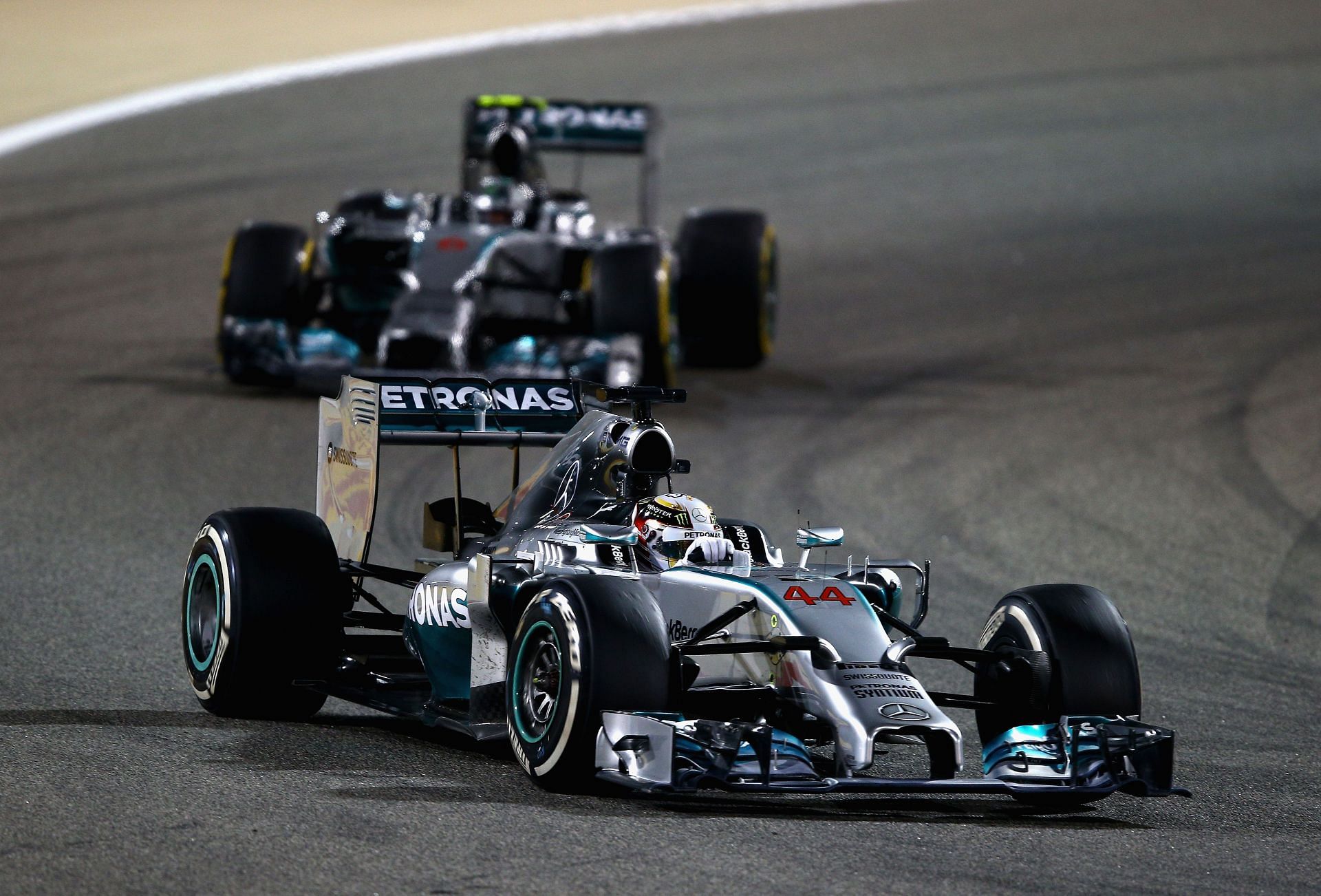 Lewis Hamilton - #44 leads Nico Rosberg - #06, both driving Mercedes W05s, 2014 Bahrain Grand Prix