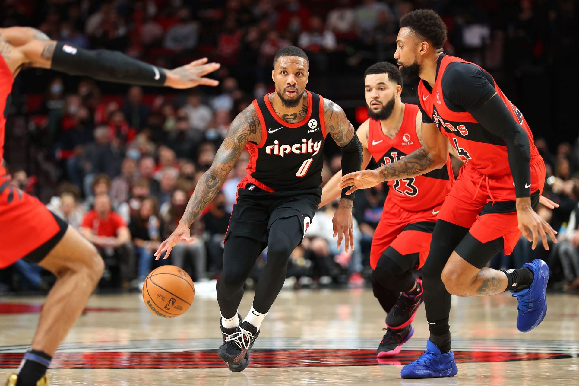 Damian Lillard #0 of the Portland Trail Blazers drives up court against the Toronto Raptors in the first quarter at Moda Center on November 15, 2021 in Portland, Oregon.
