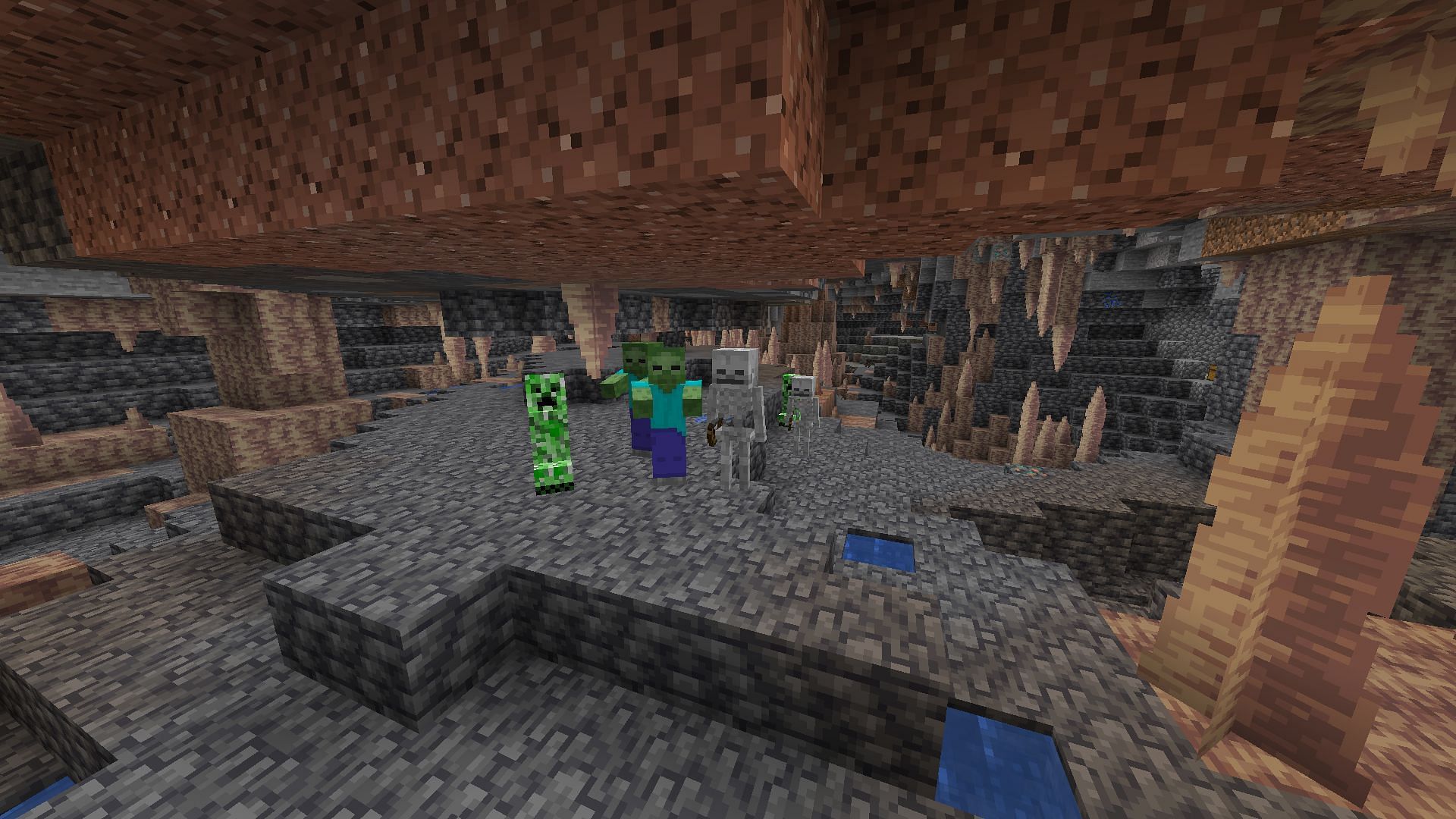 Hostile mobs in a dripstone cave (Image via Minecraft)