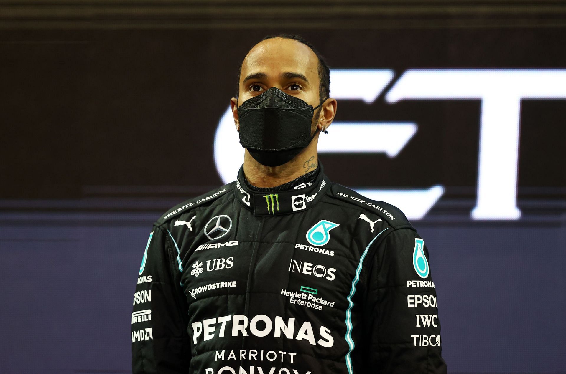 Second-placed Lewis Hamilton on the podium during the 2021 Abu Dhabi Grand Prix. (Photo by Bryn Lennon/Getty Images)