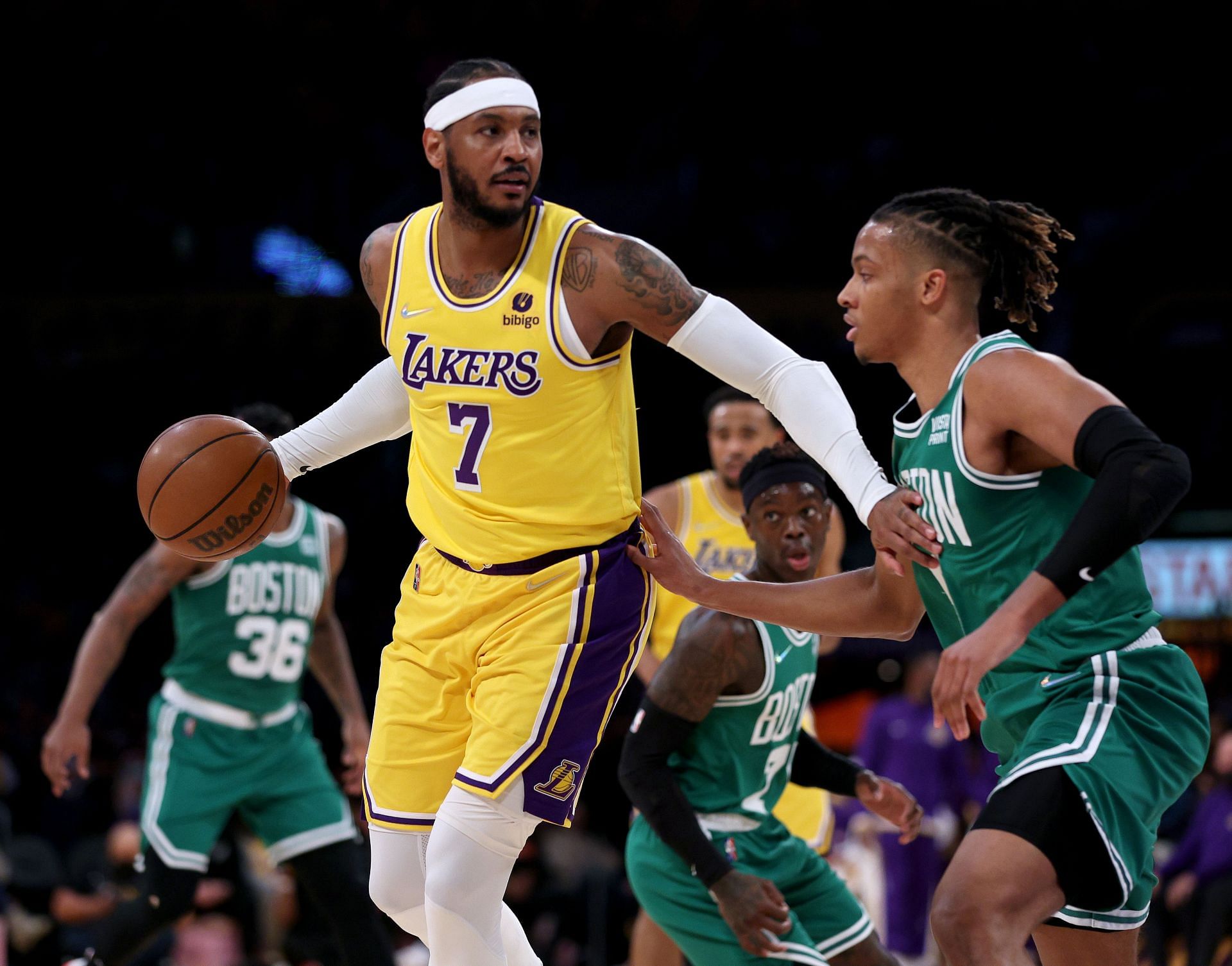 Carmelo Anthony #7 of the Los Angeles Lakers controls the ball in front of Romeo Langford #9 of the Boston Celtics during the first half at Staples Center on December 07, 2021 in Los Angeles, California.