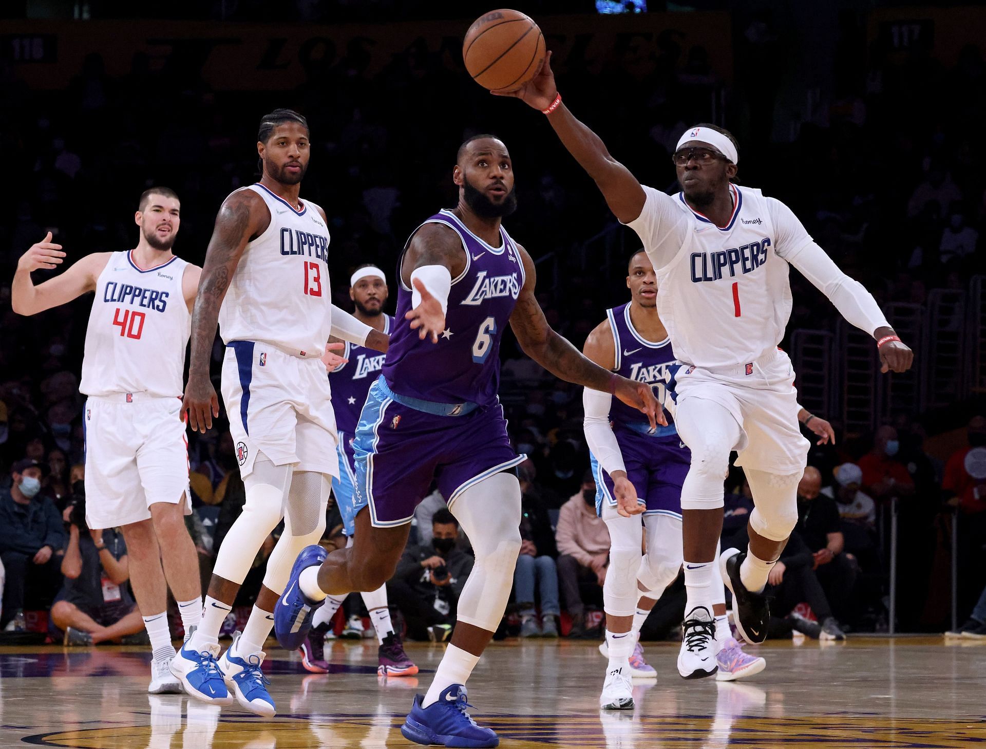 Reggie Jackson hustles for the ball at the LA Clippers vs LA Lakers game