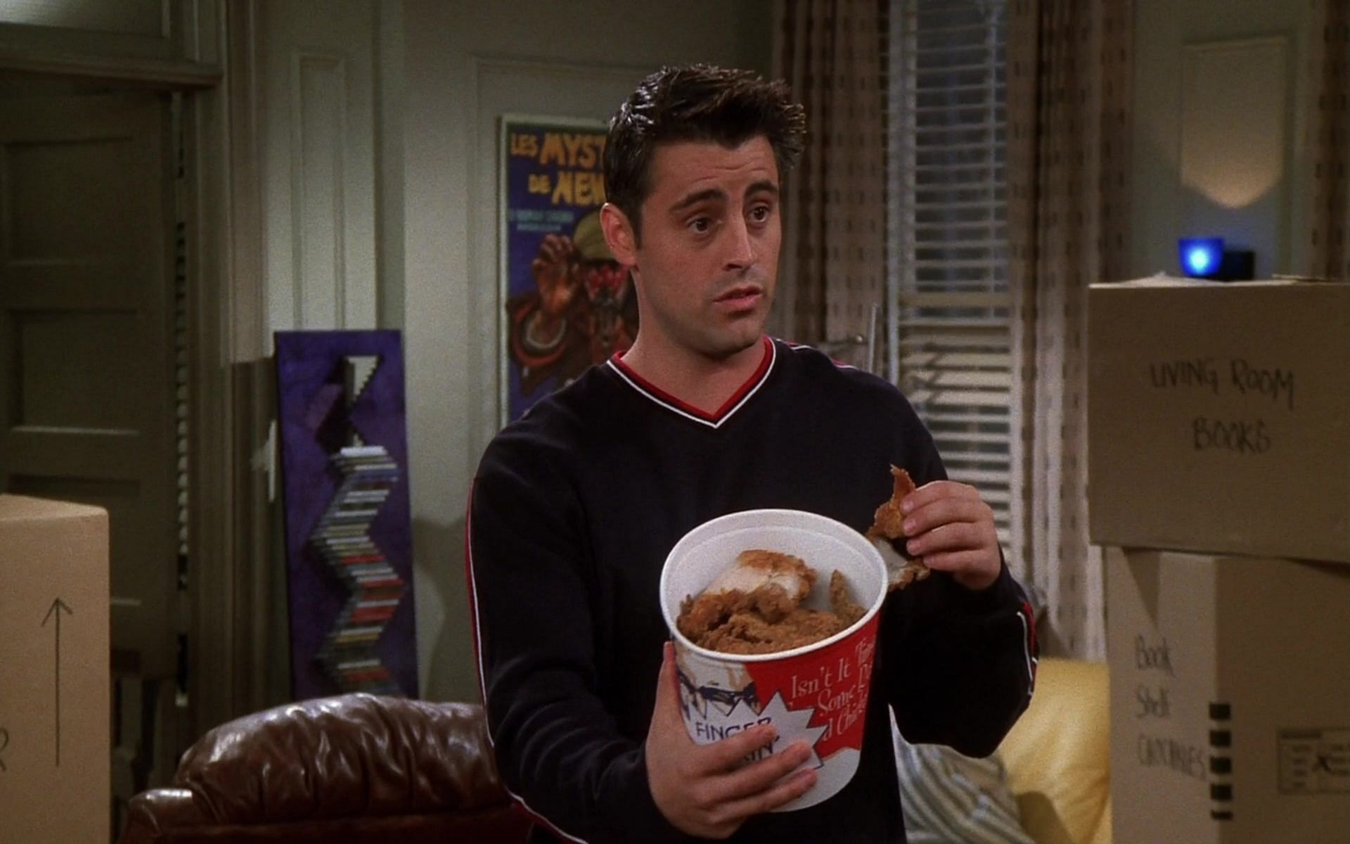 Still from Friends - Joey with his bucket of chicken (Image via YouTube)