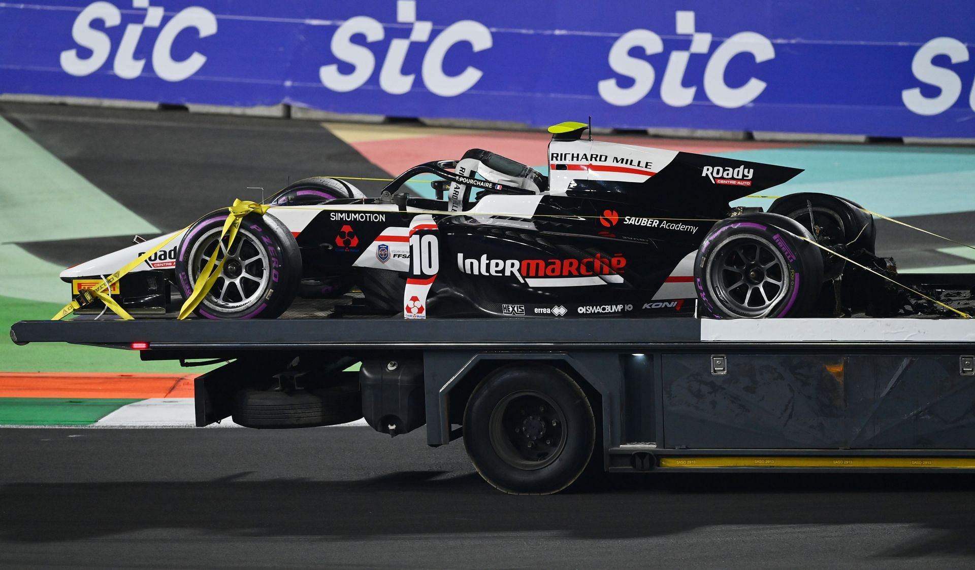The car no.10 of Theo Pourchaire being carried away after the opening lap crash.