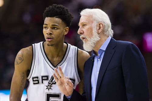 Dejounte Murray and head coach Gregg Popovich of the San Antonio Spurs.