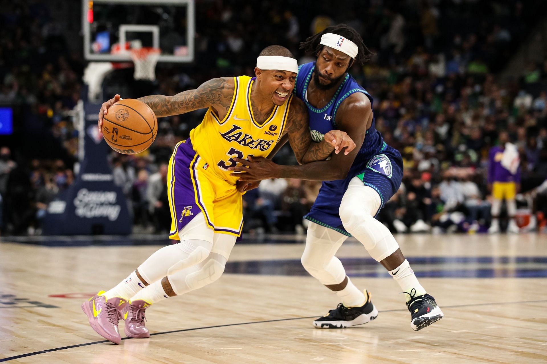 Isaiah Thomas #31 of the LA Lakers drives to the basket while Patrick Beverley #22 of the Minnesota Timberwolves defends
