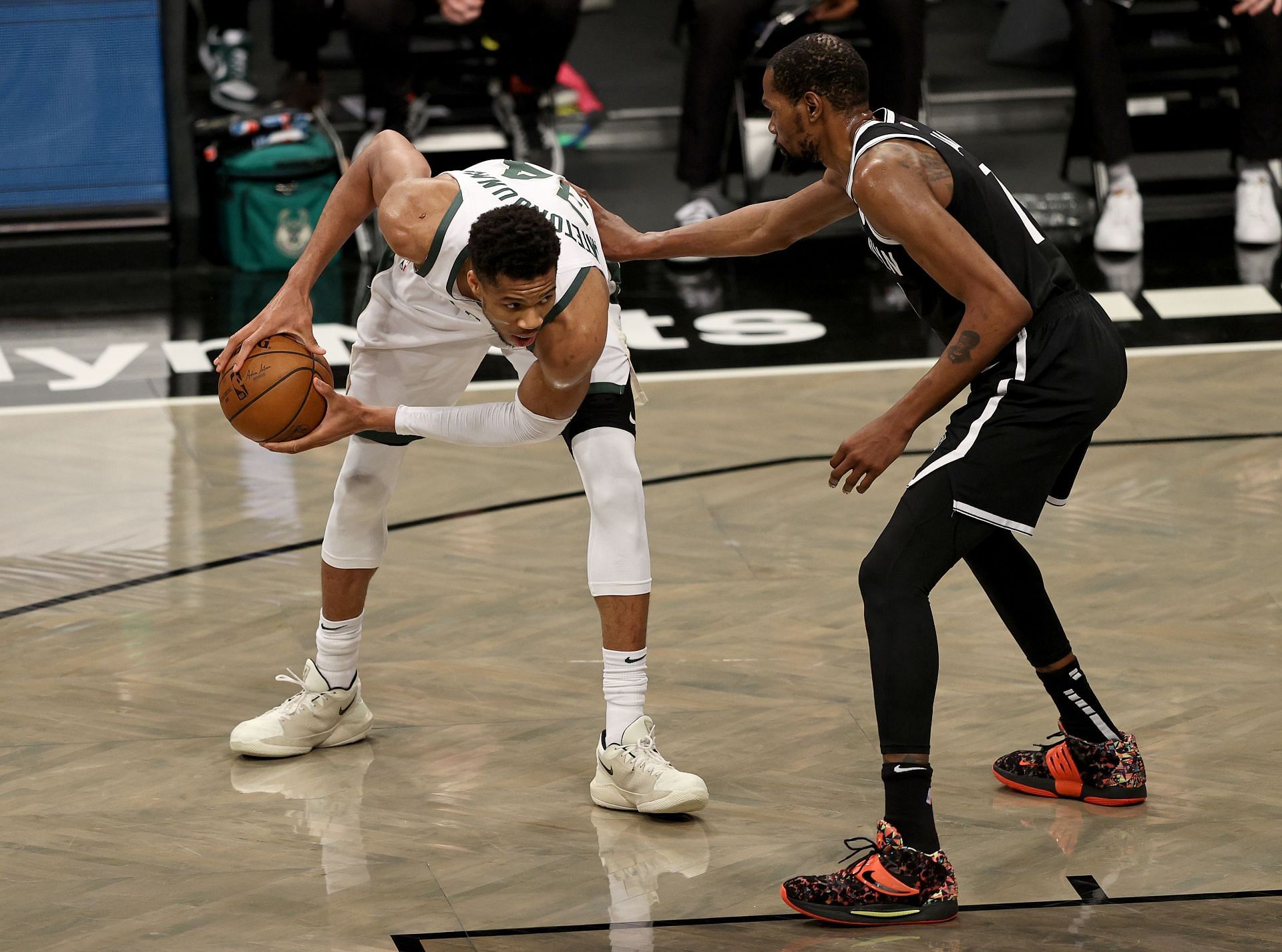 Giannis Antetokounmpo #34 of the Milwaukee Bucks heads for the net as Kevin Durant #7 of the Brooklyn Nets defends.