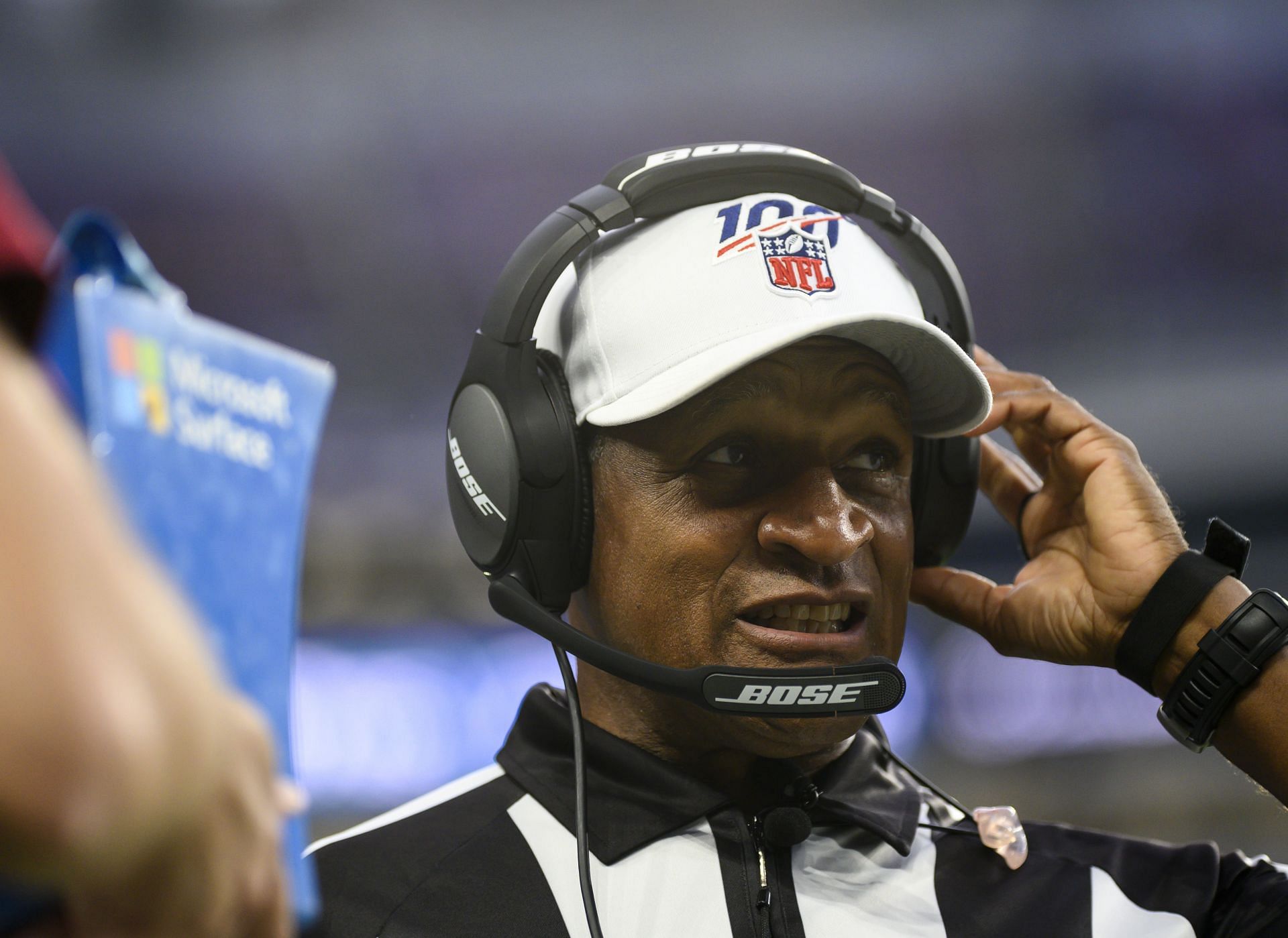 Referee Jerome Boger wears a Crucial Catch hat during an NFL