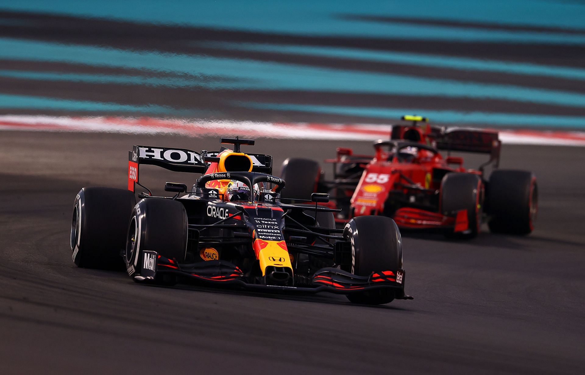 F1 Grand Prix of Abu Dhabi - Red Bull&#039;s Max Verstappen (#33, fore) leads the Ferrari of Carlos Sainz (#55)