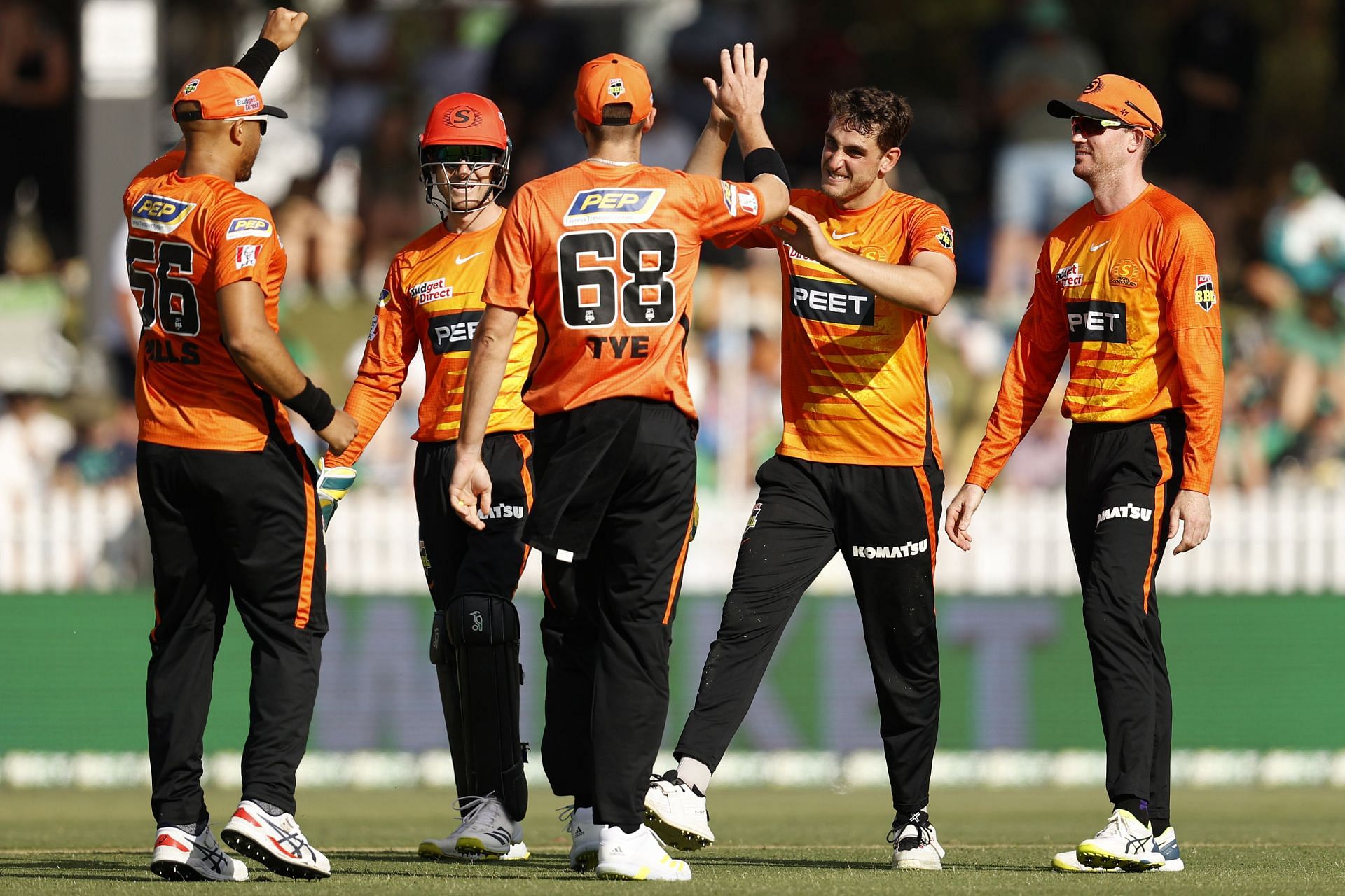 Perth Scorchers players react during a BBL match.