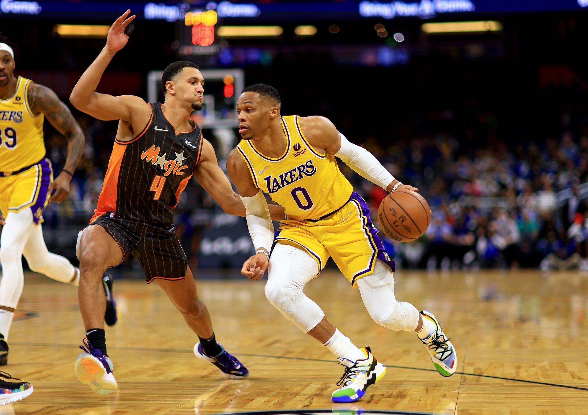 Russell Westbrook #0 of the Los Angeles Lakers drives on Cole Anthony #50 of the Orlando Magic during a game at Amway Center on January 21, 2022 in Orlando, Florida.