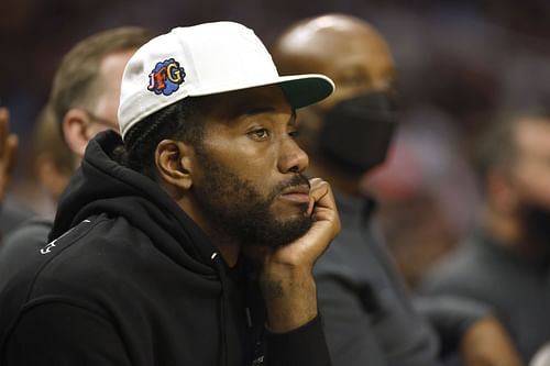 Kawhi Leonard #2 of the LA Clippers looks on from the bench during the second half of a game against the Memphis Grizzlies at Staples Center on October 23, 2021 in Los Angeles, California.