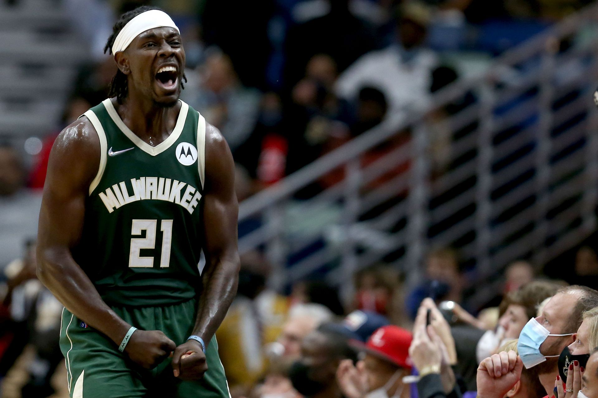 Jrue Holiday celebrates a tough basket.