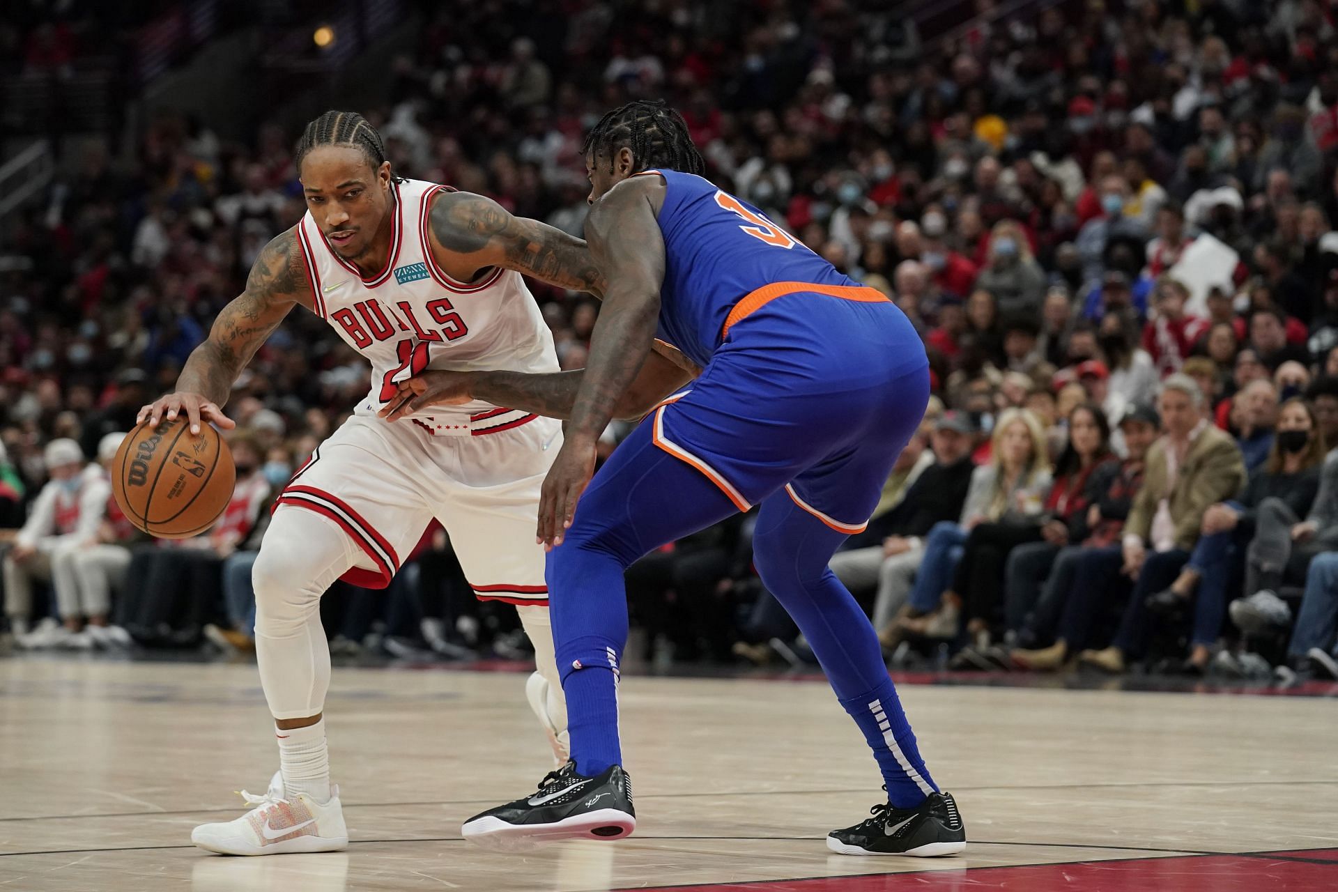 DeMar DeRozan #11 of the Chicago Bulls dribbles the ball against Julius Randle #30 of the New York Knicks