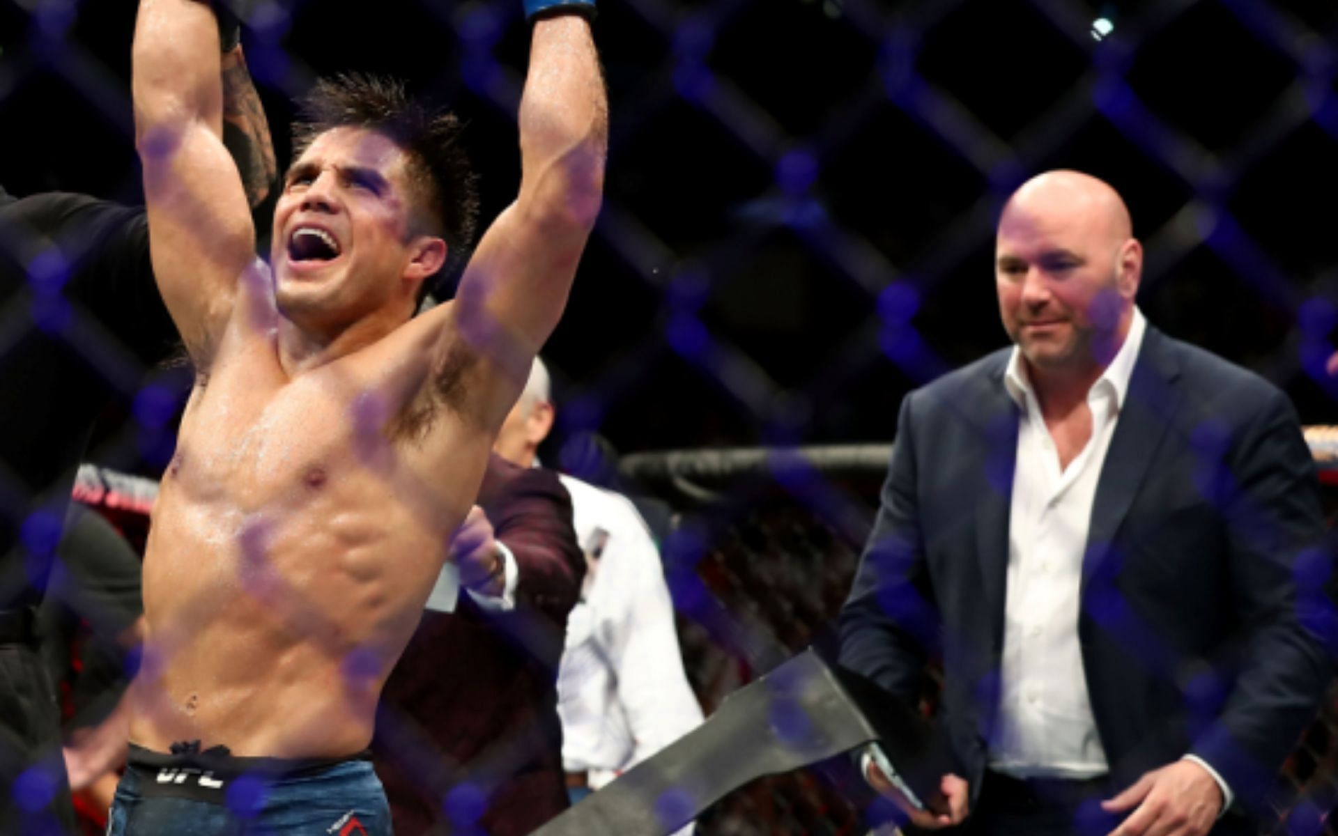 Henry Cejudo (left) celebrates his flyweight title win at UFC 227 as Dana White (right) looks on