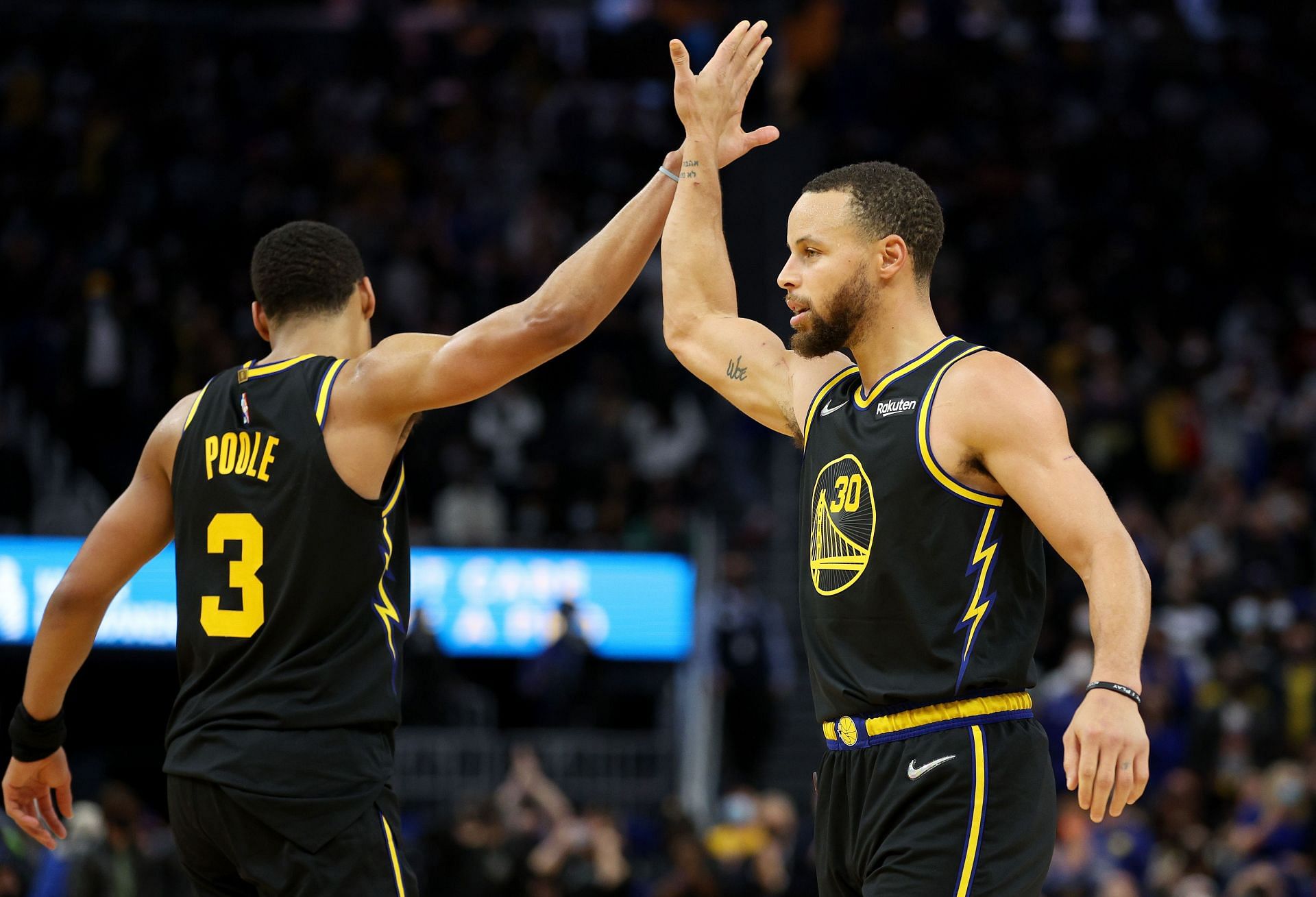 Jordan Poole and Stephen Curry of the Golden State Warriors