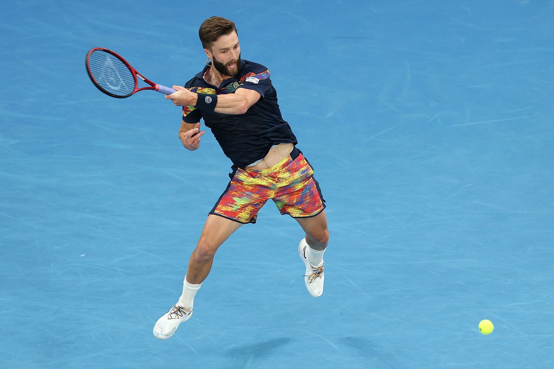 Liam Broady hits a forehand at the 2022 Australian Open