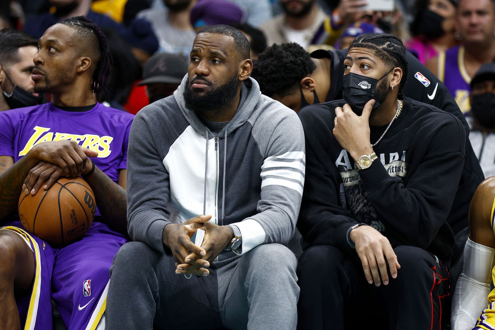 LeBron James #6 and Anthony Davis #3 of the Los Angeles Lakers look on from the sideline