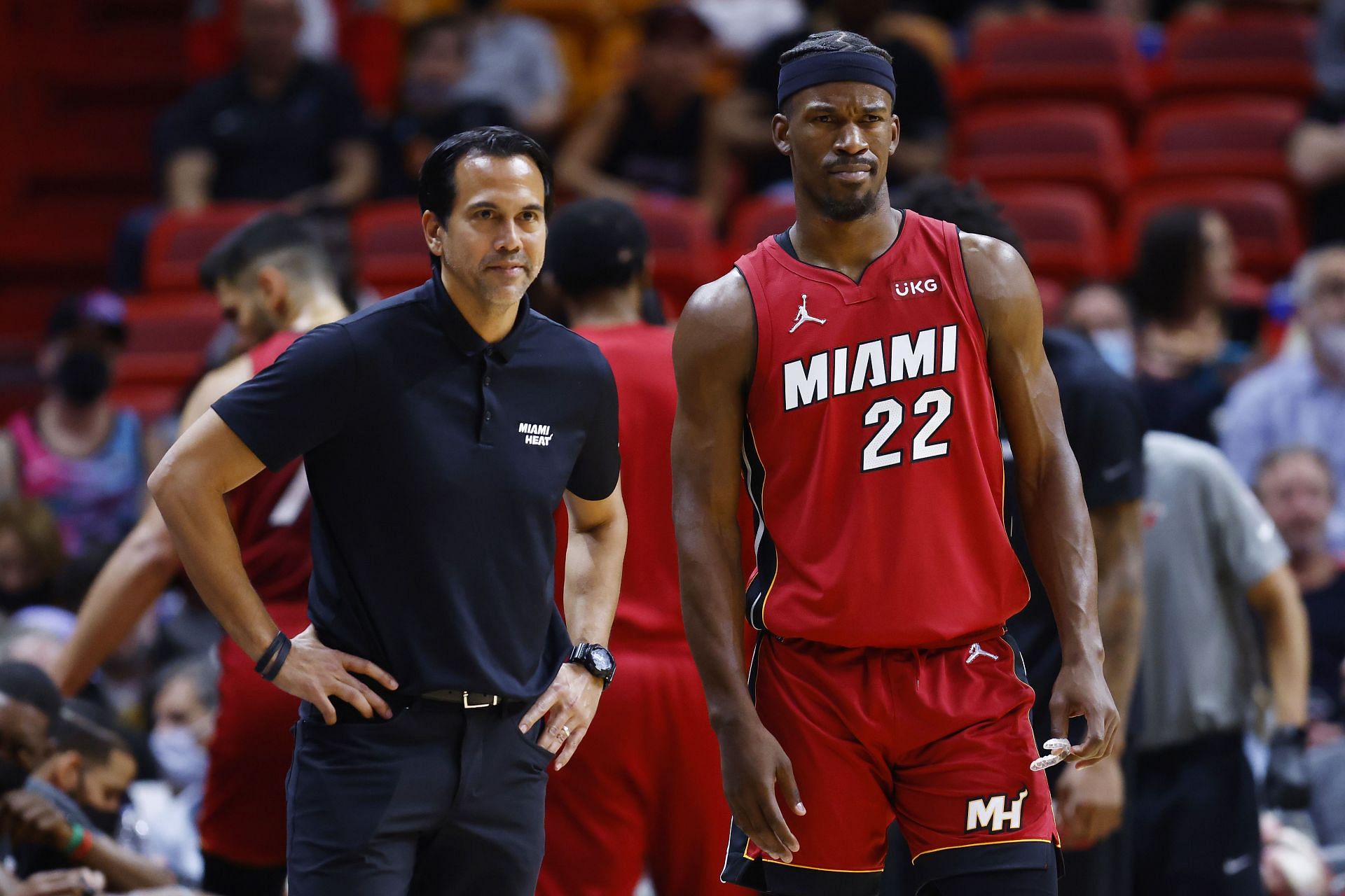 Jimmy Butler and head coach Erikk Spoelstra look on at the Heat game